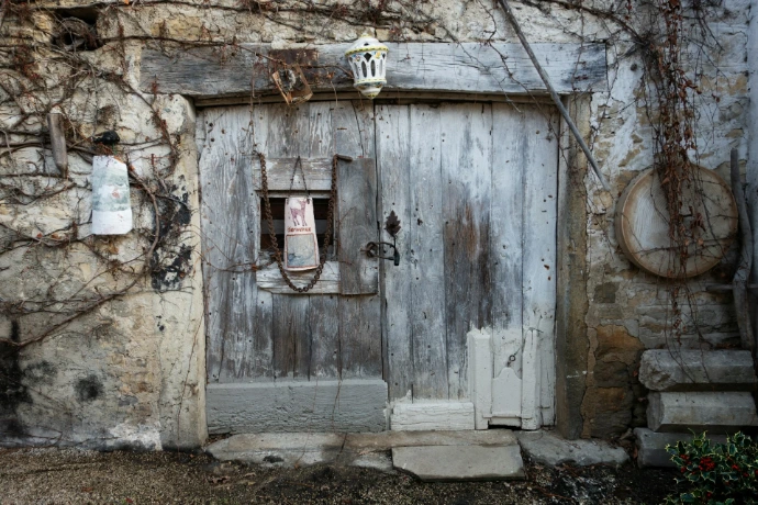 An old building with a door and a window